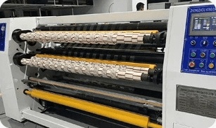 Adhesive tape machine rolls loaded on a slitting machine at the UCF facility